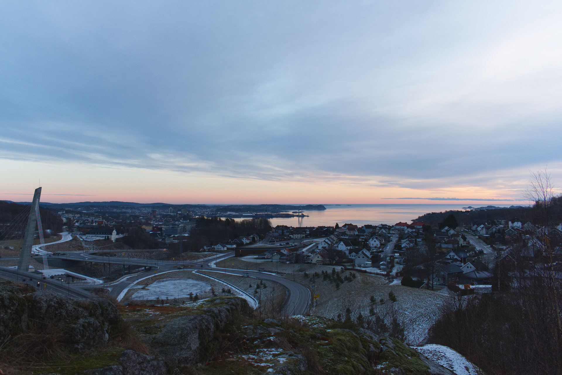 a landscape photo of the town of Larvik at sunset